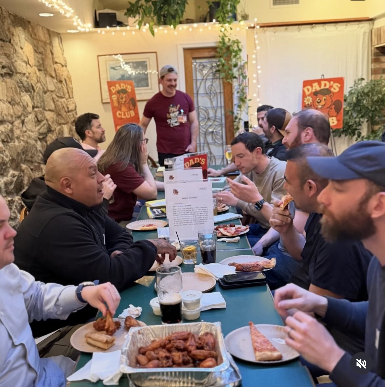 Dads in conversation around a table