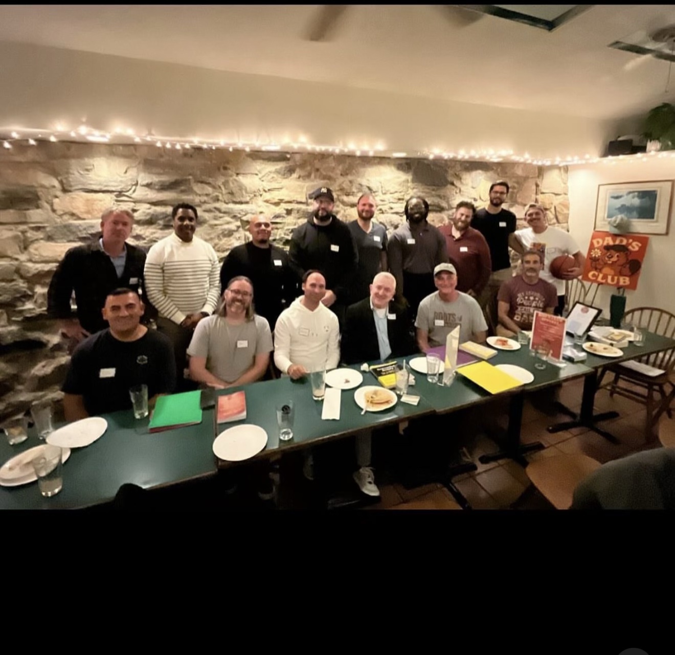 Dads gathered around the table at Dad’s Club