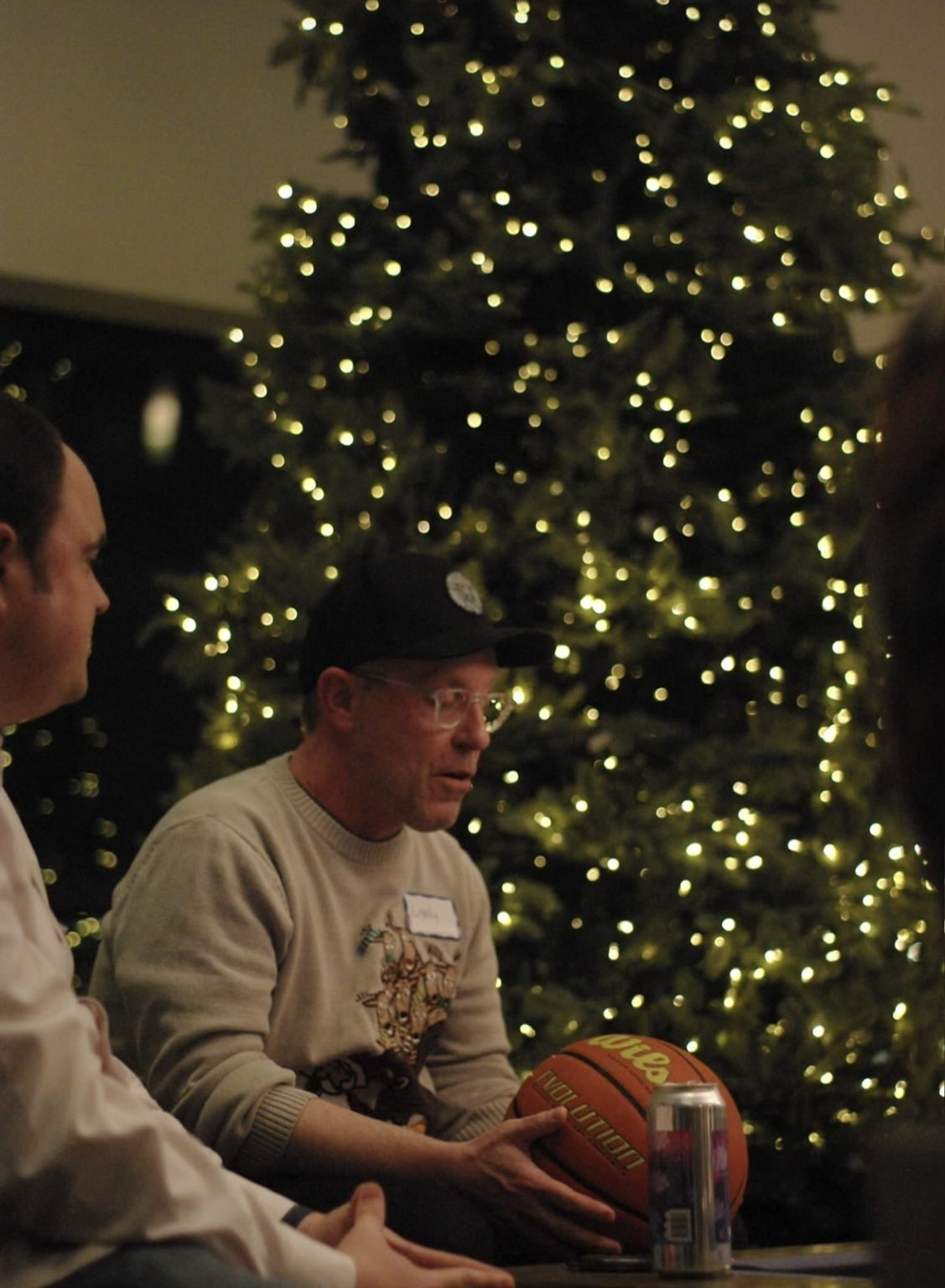 Dads sharing a conversation at a winter gathering
